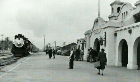 People on the depot platform as a train arrives in Modesto about 1940.